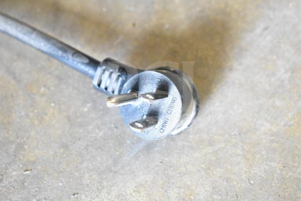 Power cord plug from 2019 True GDM-49-HC Commercial Freezer, 115 Volts, 1 Phase, showing "CHING CHENG" and voltage marking.