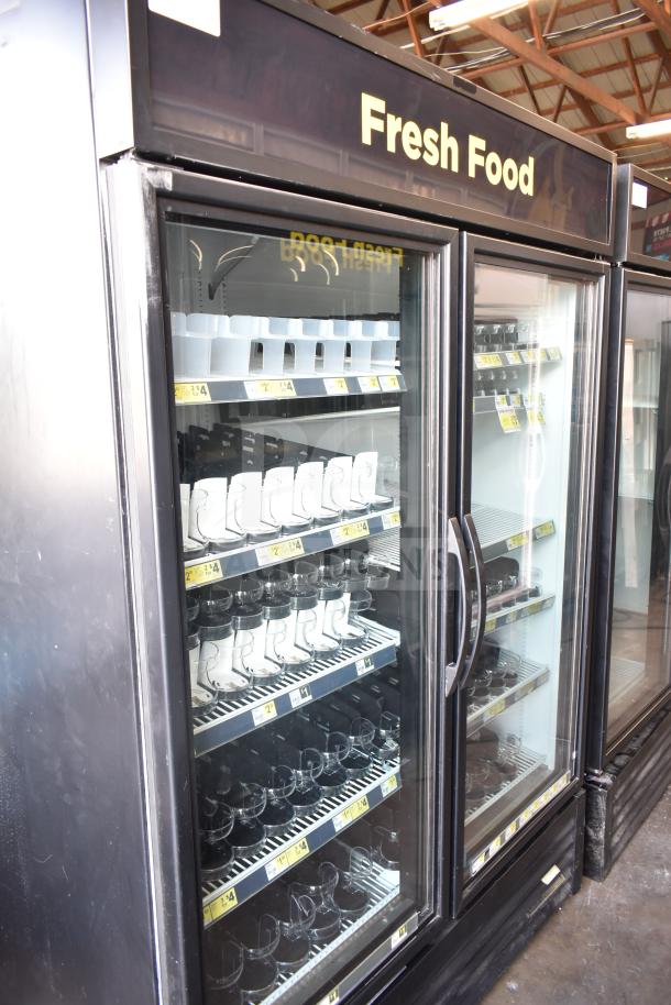 2016 True GDM-49-HC two-door reach-in cooler merchandiser, 115 volts, "Fresh Food" signage, clean condition.