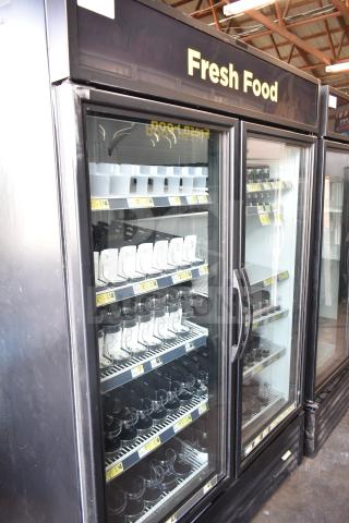 2016 True GDM-49-HC two-door reach-in cooler merchandiser, 115 volts, "Fresh Food" signage, clean condition.