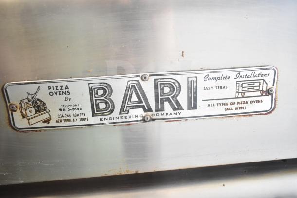 Bari M354 commercial natural gas single deck pizza ovens with installation label, shows wear, unique vintage appeal.