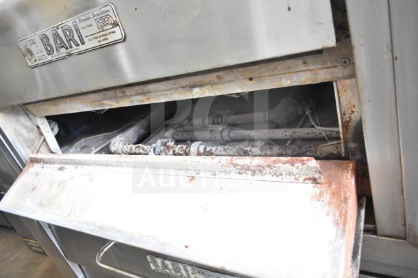 Bari M354 commercial single deck pizza oven, natural gas, visible wear and rust. Bari label indicates make and model.