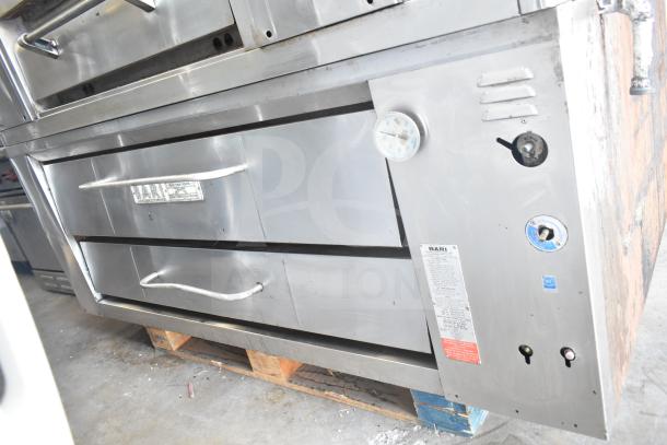 Bari M354 commercial natural gas single deck pizza oven, stainless steel, temperature gauge, visible wear, model label shown.