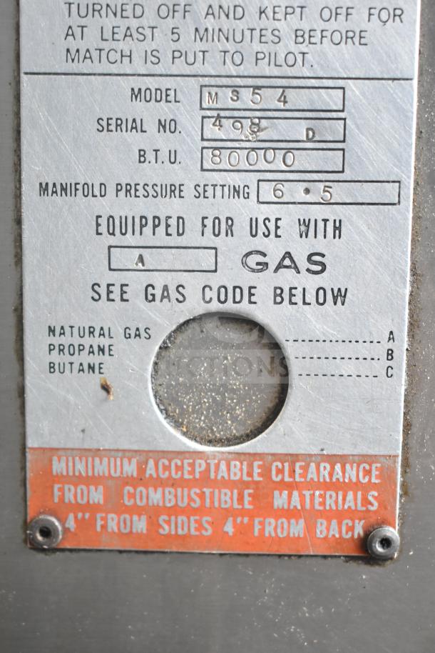 Metal label of Bari M354 commercial pizza oven. Serial No: 498D, BTU: 80,000, natural gas equipped, pressure setting: 6.5.