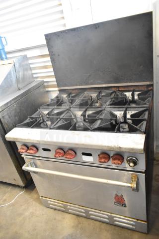 Wolf CHSSR-6-29 commercial 6-burner gas range with oven and backsplash, features red knobs, in used condition.