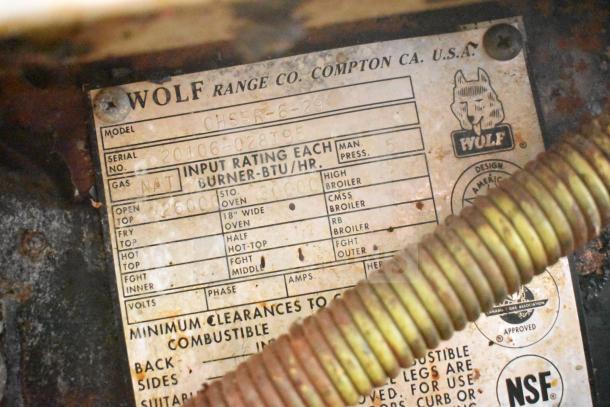 Wolf CHSSR-6-29 range label; shows serial number 20106-028T95, gas type NAT, and BTU ratings. NSF approved.