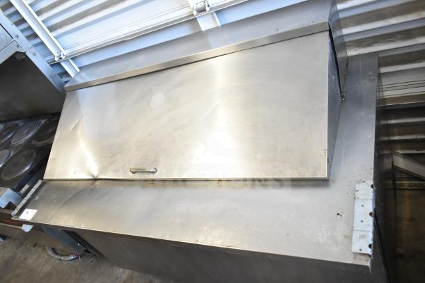 True TSSU-60-24M-B Commercial Sandwich Salad Prep Table, stainless steel, on casters. 115V, 1 phase. Used condition.