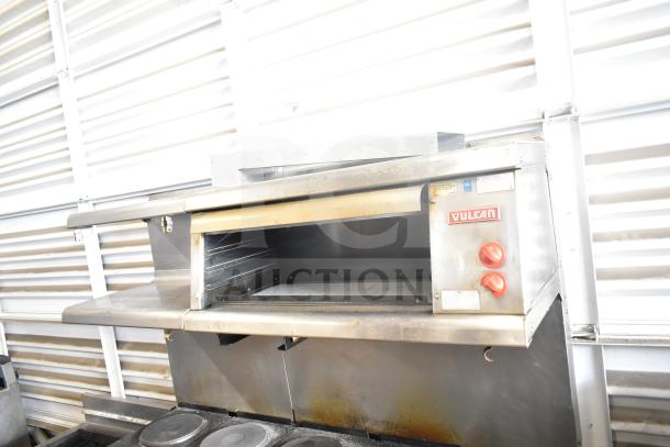 Vulcan ESB60 commercial electric hot plate range, 10 burners, 2 ovens, salamander cheese melter, 208V, 3 phase, slight wear.