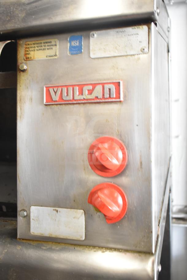 Vulcan ESB60 commercial electric hot plate range with red knobs, visible Vulcan logo, and voltage markings.