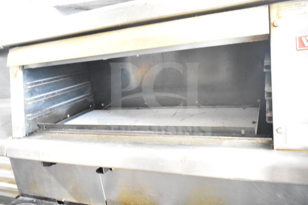 Vulcan ESB60 commercial range with 10 burners, 2 ovens, and a salamander cheese melter. Stainless steel, 208V, 3 phase.