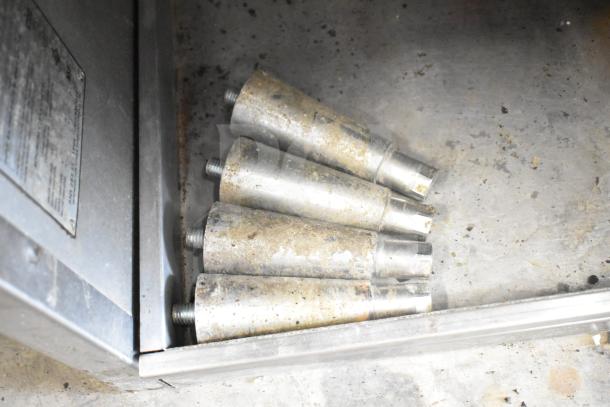 Wolf SCB25F-1 Commercial Natural Gas Charbroiler Grill. Image shows worn metal parts. Missing grates.