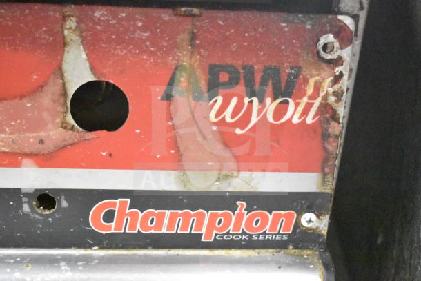 APW Wyott Champion Commercial Gas Griddle, showing logo and wear, suitable for countertop cooking.