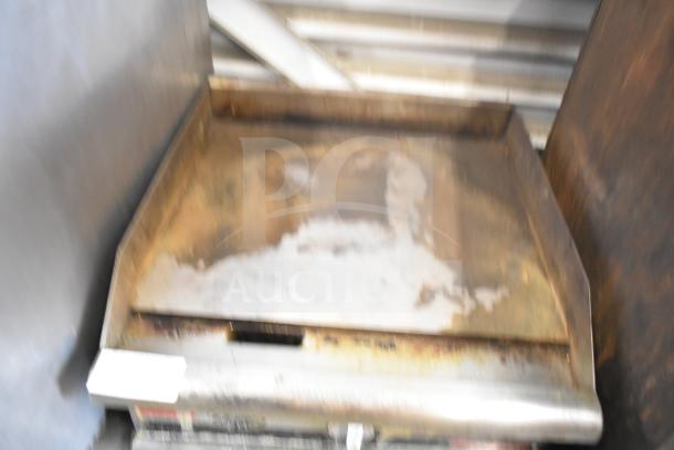 APW Wyott Champion gas countertop griddle, worn condition, showing surface rust and discoloration, ideal for commercial use.