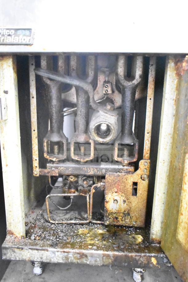 Pitco Frialator commercial deep fryer, natural gas, 90,000 BTU, with 2 side splash guards. Visible wear and grease buildup.
