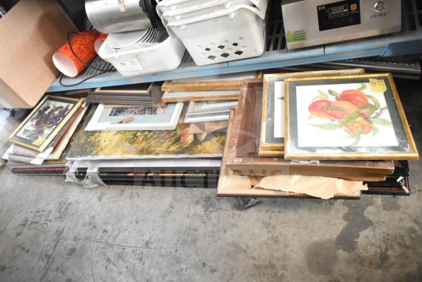 29 various framed pictures bundled together. Mix of styles and sizes. Some show wear. Ideal for eclectic decor.