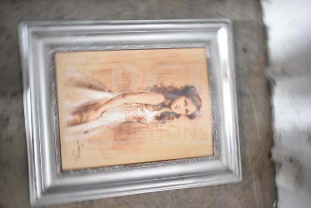 Framed painting of a woman in a white dress with flowers, housed in a detailed silver frame, part of 29-piece set.