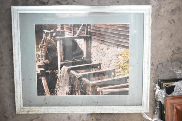 Framed picture of a rustic watermill with a white frame. Includes 28 additional various framed pictures in lot.
