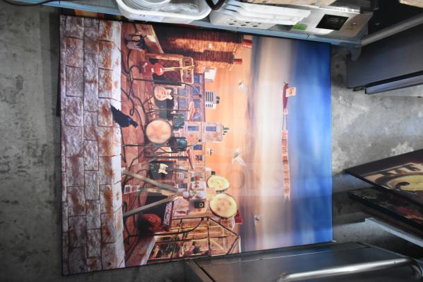 Framed art print featuring a vibrant cityscape with musical elements and "All You Need is Love" banner, excellent condition.