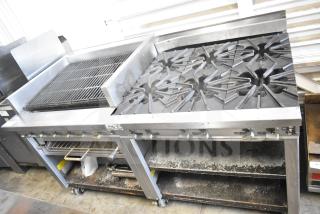 Montague UF-36R commercial gas range with 6 burners, left charbroiler, under shelves, on casters; stainless steel, used condition.