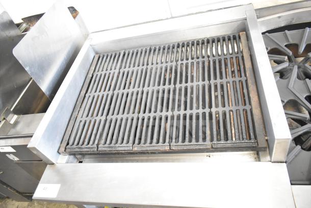 Montague UF-36R 6-burner range with left side charbroiler, natural gas, commercial shelving, on casters. Good condition.