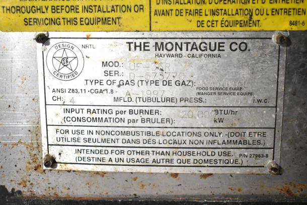 Montague UF-36R gas-powered 6-burner range with charbroiler. Features under shelves, commercial casters. Model label visible.
