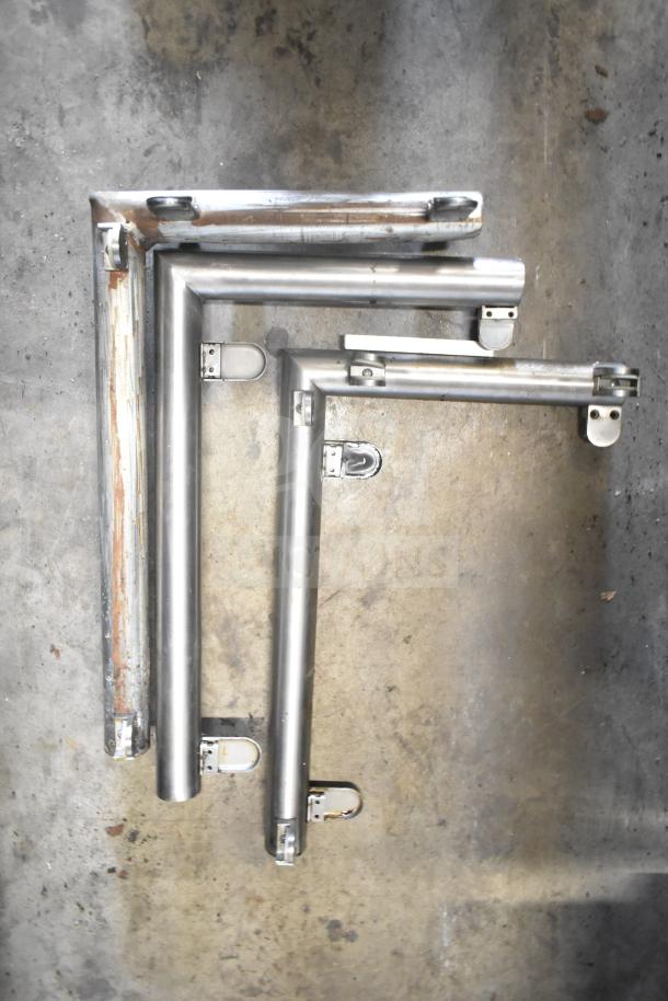 Montague UF-36R gas range frame components on concrete floor, showing robust metal casters.