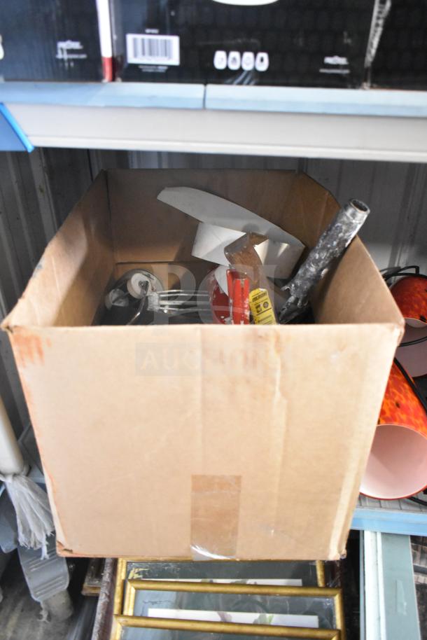 Box of assorted items including white buckets, an air pot, various lights, paint rollers, brushes, and tools, in used condition.