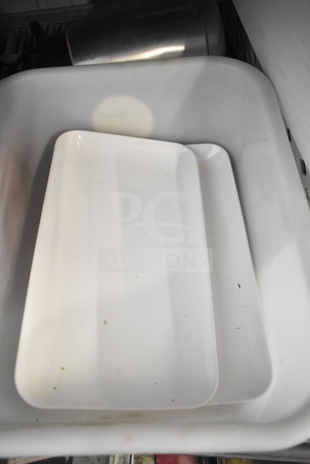 Lot with white poly buckets, metal air pot, rectangular trays, and various tools. Some trays show minor stains.