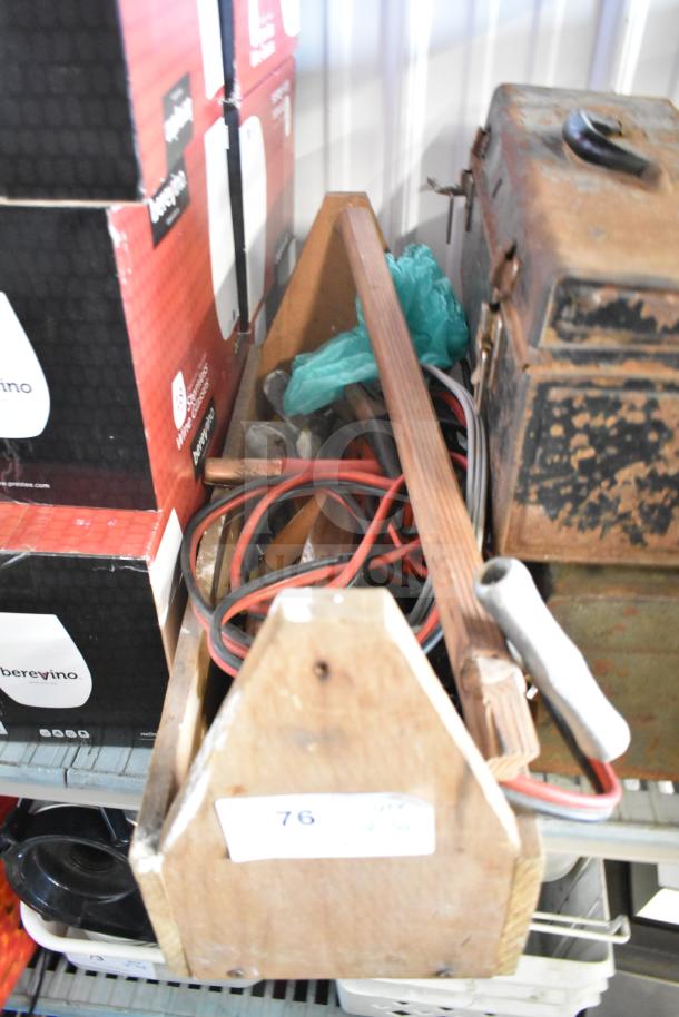 Lot of various items including jumper cables, tools, clamp, rusty toolbox. Items in used condition. Label marked "76."