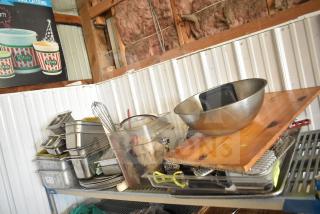 Lot of kitchen items including stainless steel drop-in bins, bowl, cutting board, utensils, and round baking sheets.