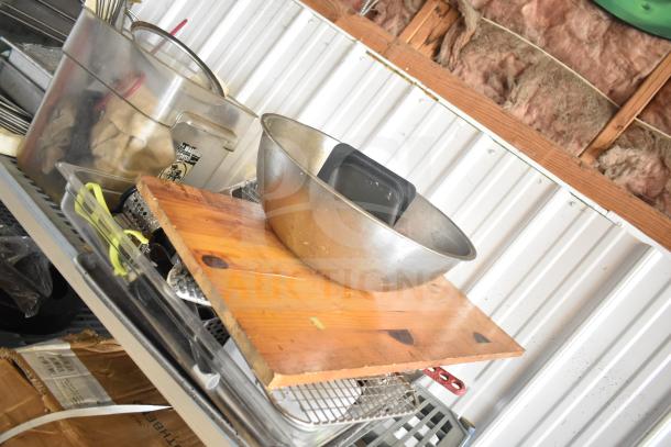 Lot includes stainless steel bins, mixing bowl, wooden cutting board, utensils, and round baking sheets, fair condition.