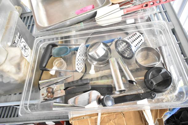Lot of kitchen items including stainless steel bins, utensils, bowl, cutting board, and baking sheets, various conditions.