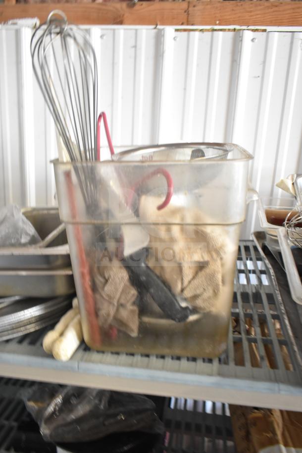Lot with stainless steel bins, bowl, cutting board, utensils, baking sheets; used condition. Includes whisks, towels, and knives.