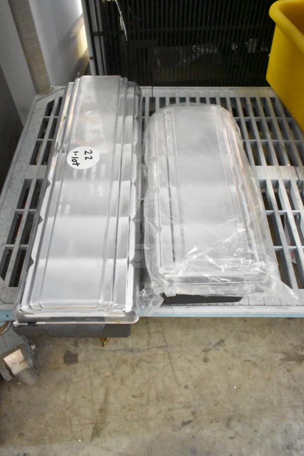 Four items including two Honeywell Home CG512A thermostat guards and two poly bar topping rails, stacked on a grate shelf.