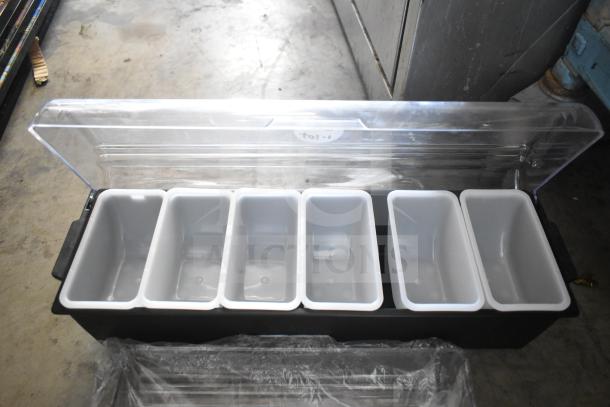 Clear storage container with six compartments, open lid. Suitable for organizing items. No visible markings or tags.
