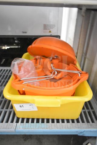 Orange countertop vegetable cutter in a yellow tub; includes metal handles, intact condition, auction label "81, QTY 1.”