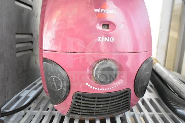 Bissell 4122 Zing Vacuum Cleaner, red, 120V, visible wear, model markings clear, functional knobs, auction item.
