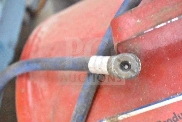 Midwest Products Portable Air Tank, red, with attached blue hose and nozzle, used condition, some wear visible.