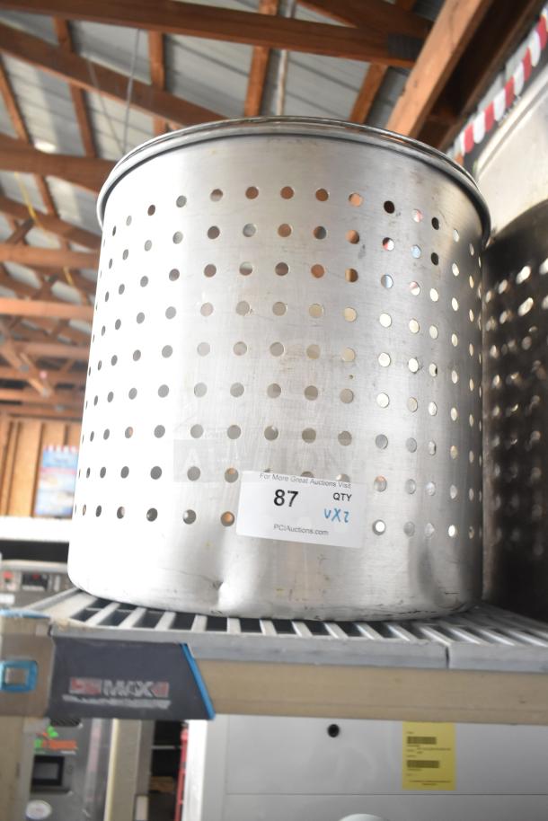 Steamer pot insert with perforated design on shelf. Visible auction label reads "87 QTY VZ" from PCI Auctions.