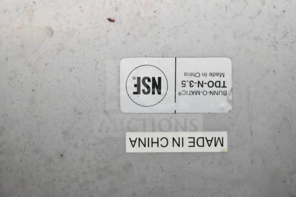 BUNN-O-MATIC beverage holder dispenser with NSF label, made in China. Includes steamer pot insert. Used condition.