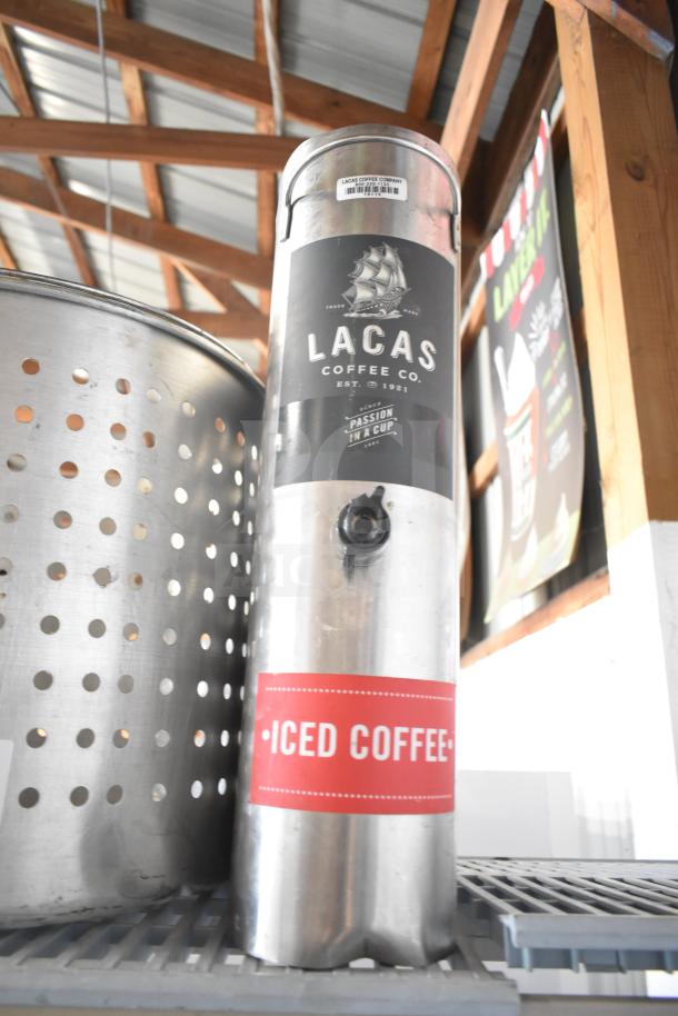 Two items: a Lacas Coffee Co. iced coffee dispenser and a perforated steamer pot insert, both in good condition.