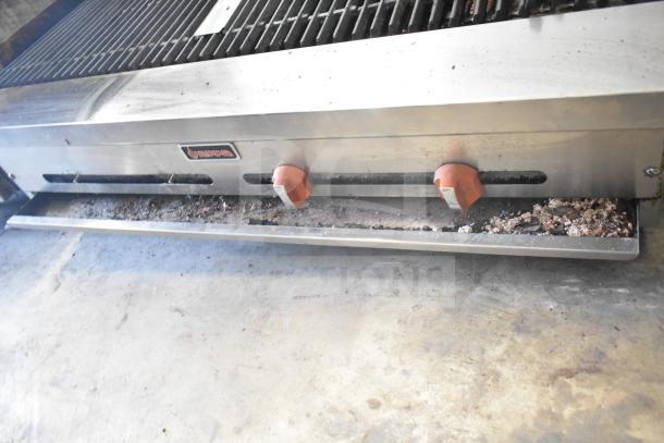 Sierra Commercial Countertop Gas Charbroiler Grill with dual knobs, stainless steel, shows signs of use, visible grease residue.