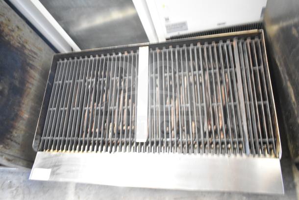 Sierra Commercial countertop gas charbroiler grill, stainless steel, used condition, with visible grilling grates.