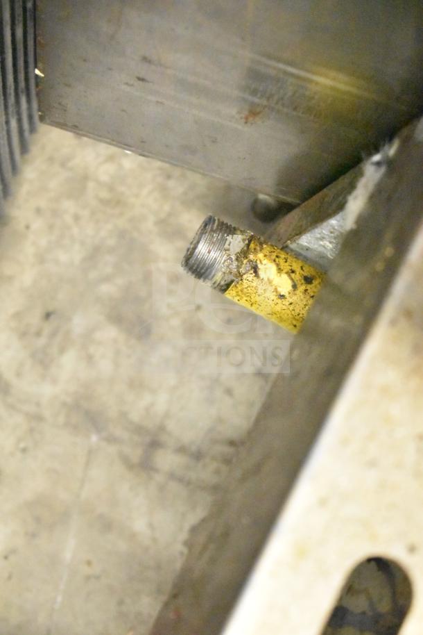 Sierra Commercial Countertop Gas Charbroiler Grill showing a metal gas connection pipe, condition indicates use.