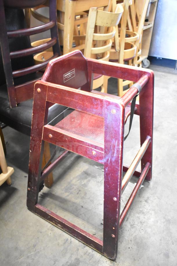 Wooden high chair, cherry finish, visible wear. Includes dining height chairs. Tag indicates robust construction. 7-item auction lot.