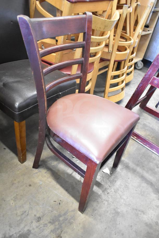 Set of 7 chairs including a high chair, mixed materials, wooden frames with cushioned seats, wear visible, ideal for dining.