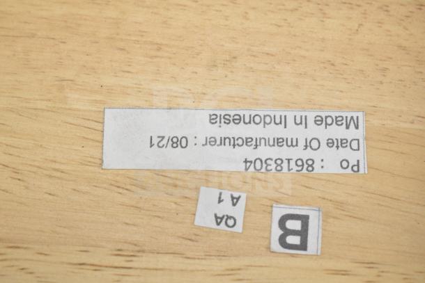Label on wooden surface reads "Made in Indonesia, Date of Manufacture: 08/21, P.O: 86138304," related to auction items.