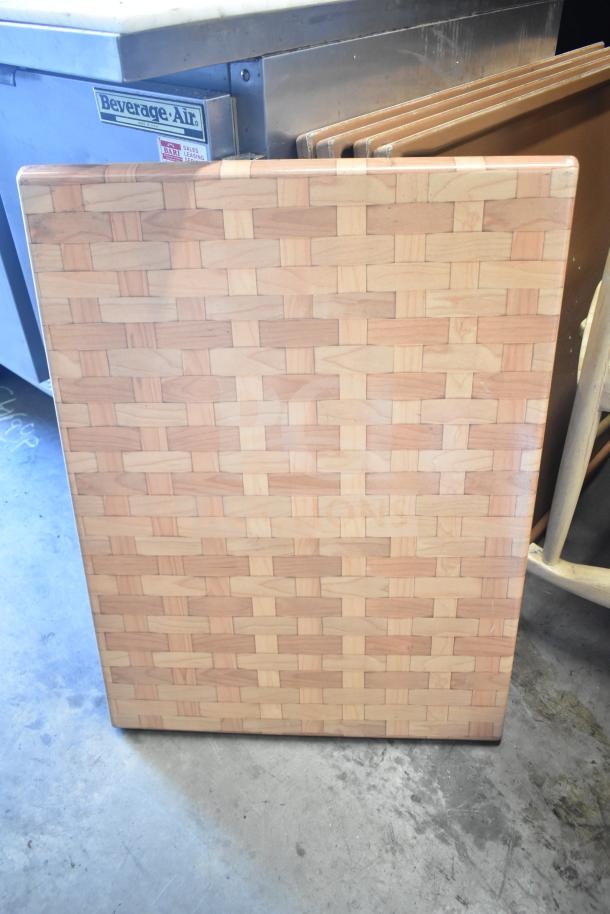 Wood-patterned tabletop with rectangular design, showing minimal wear. Five available. Ideal for restaurants or cafes.