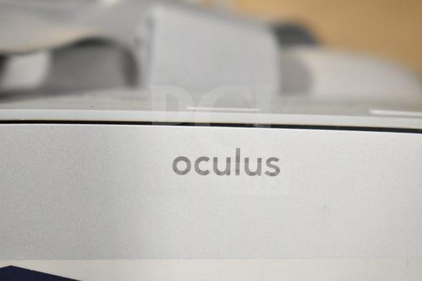 2 Oculus MH-A64 VR Headsets, featuring the Oculus logo. Excellent condition, ideal for immersive experiences.