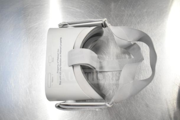 Oculus MH-A64 VR headset, white, adjustable strap, with label indicating it is Walmart property.