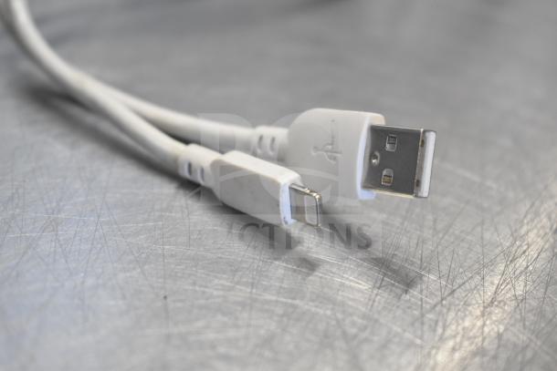 USB charging cables for Oculus MH-A64 VR Headset shown on scratched metal surface, emphasizing connectivity.